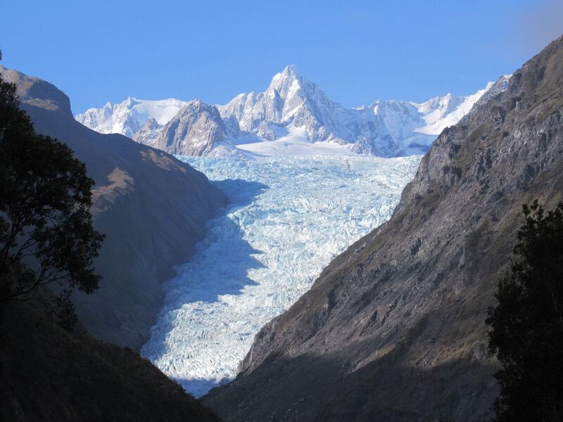 Franz Josef Glacier flowing down between mountains on the West Coast, South Island New Zealand